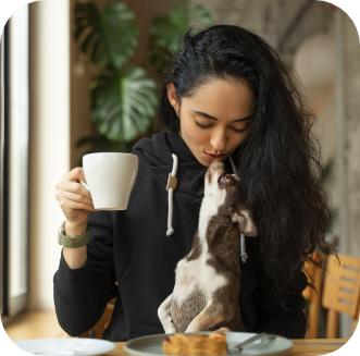 Woman with coffee and dog